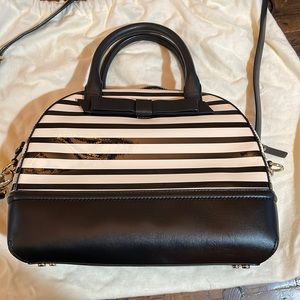 Kate Spade black and cream stripped hand bag. Only carried once. 9x12x4 in
